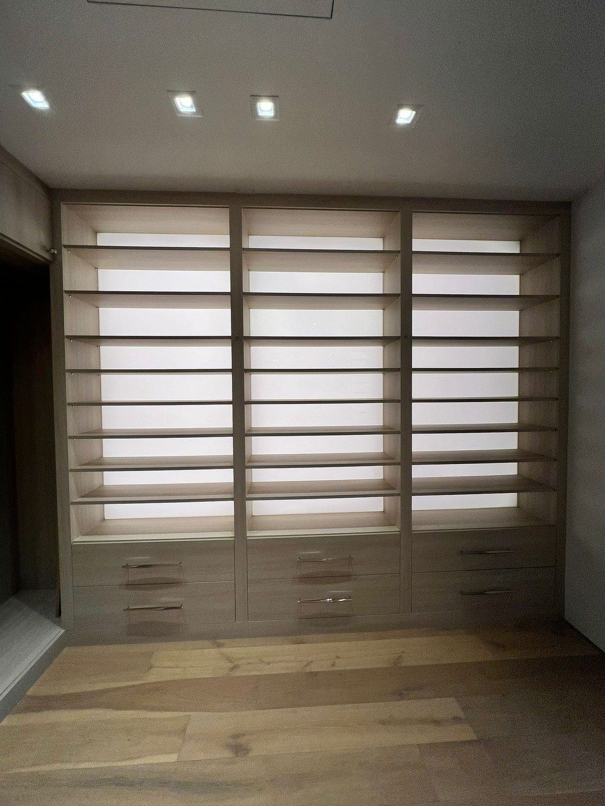 Built-in cabinetry wrapped in wood-look film