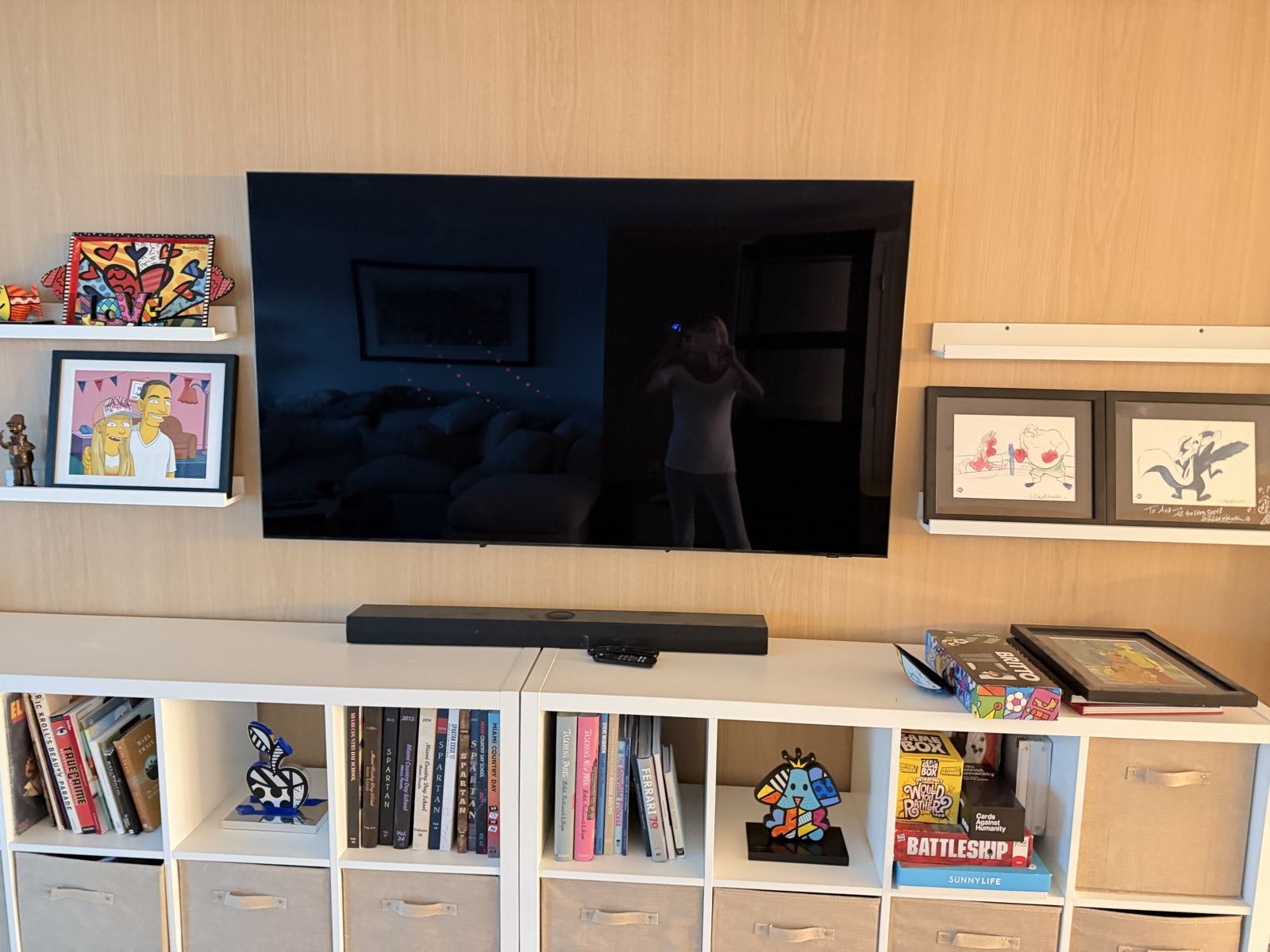 Wood-look media wall behind a TV and shelving