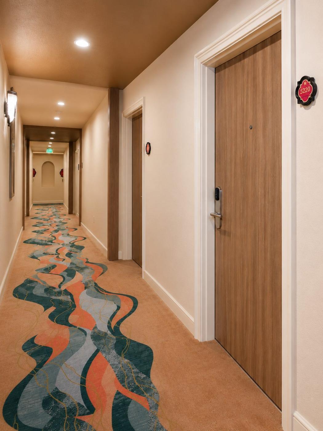 Same corridor with smooth wood-grain doors